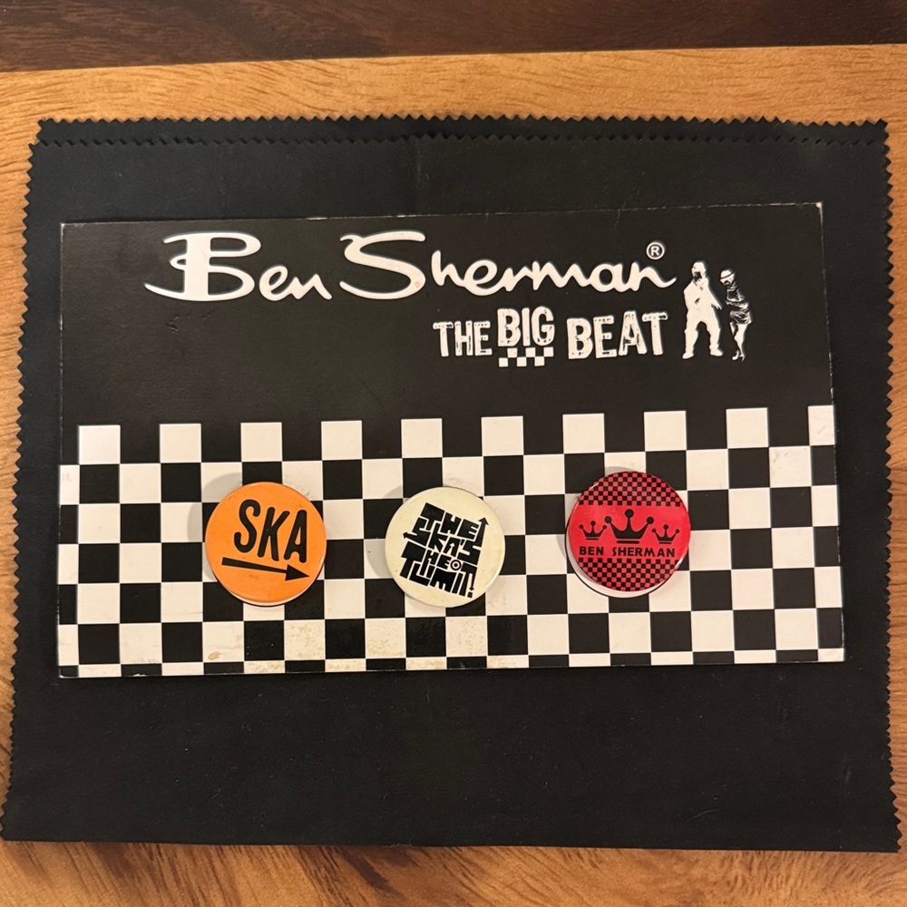 Ben Sherman Black and White Checkered Poster with Orange and Red Accents